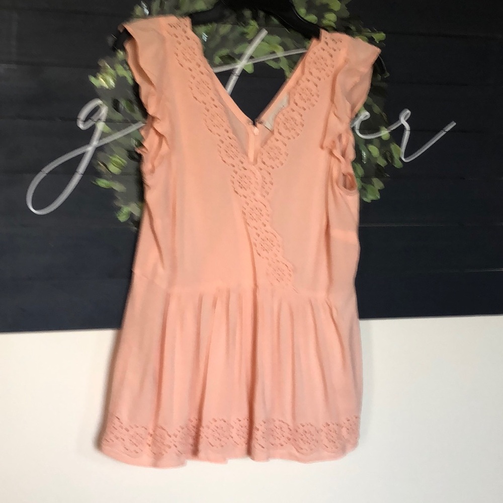 Peach eyelet top, zips in back.